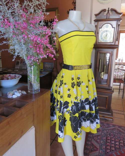 Fabulous buttercup yellow strapless dress with black/white floral flare skirt.Size 34/10 by LEGIT.