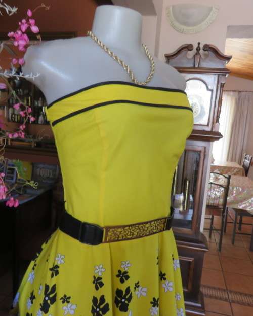 Fabulous buttercup yellow strapless dress with black/white floral flare skirt.Size 34/10 by LEGIT.
