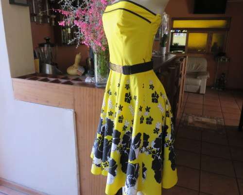 Fabulous buttercup yellow strapless dress with black/white floral flare skirt.Size 34/10 by LEGIT.