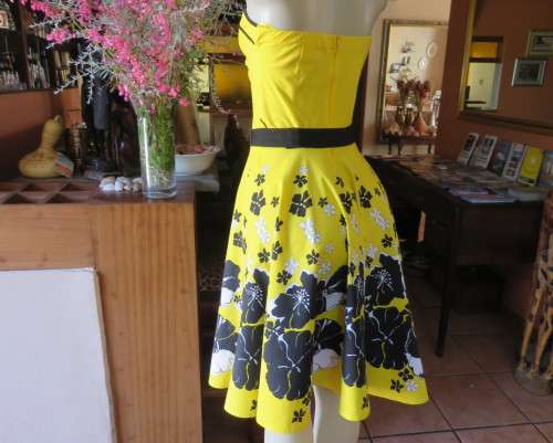 Fabulous buttercup yellow strapless dress with black/white floral flare skirt.Size 34/10 by LEGIT.