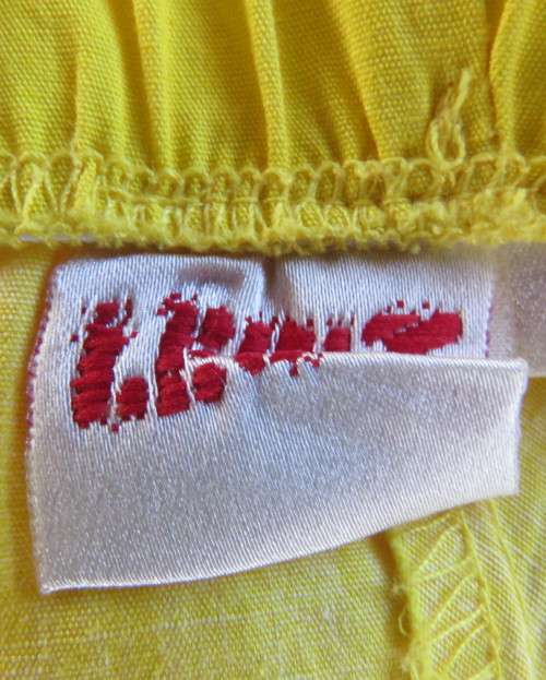 Fabulous buttercup yellow strapless dress with black/white floral flare skirt.Size 34/10 by LEGIT.