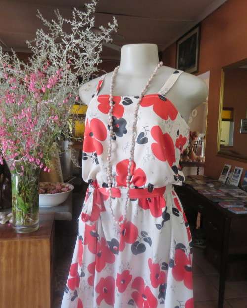 Cool cream strappy dress with red/black bold flowers.In soft polyester.Size 38.As new cond.