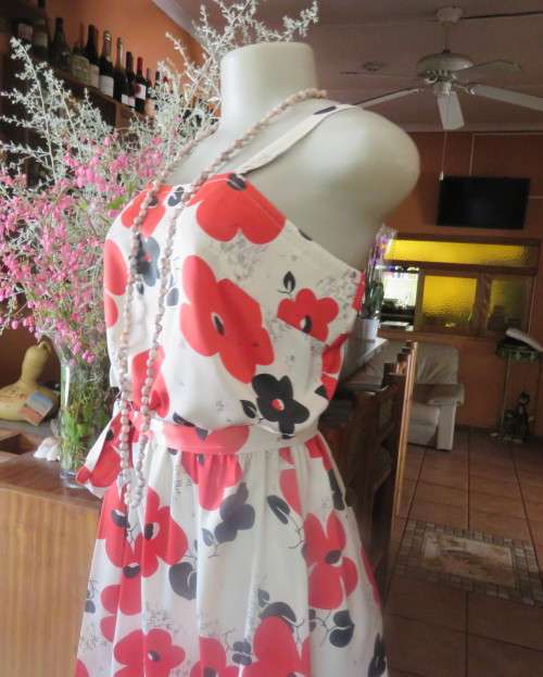 Cool cream strappy dress with red/black bold flowers.In soft polyester.Size 38.As new cond.