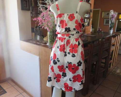 Cool cream strappy dress with red/black bold flowers.In soft polyester.Size 38.As new cond.