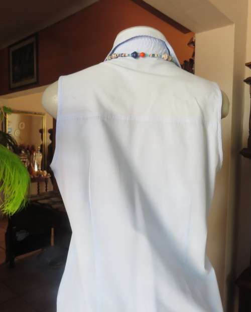 Cool baby blue long sleeveless size 36/12 top by SMILEY.Button down with shirt collar.Polycotton.