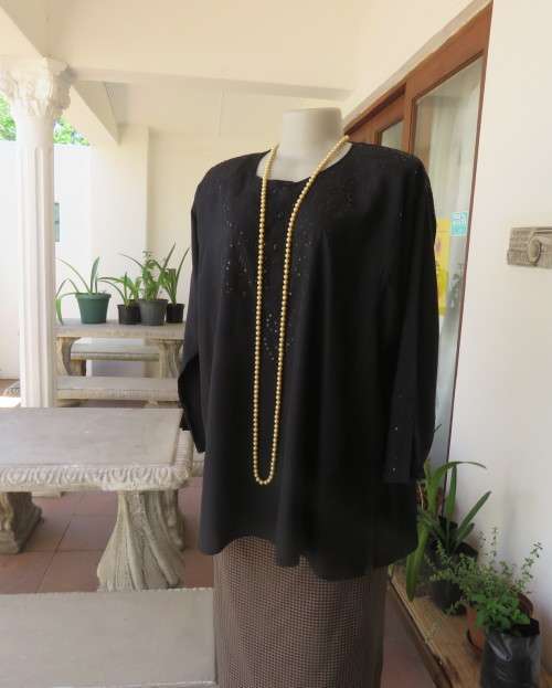 Very black long sleeve slip over 100% rayon richly embroidered/sequined top made in India.Size 46/22
