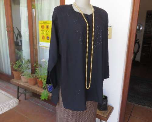 Very black long sleeve slip over 100% rayon richly embroidered/sequined top made in India.Size 46/22