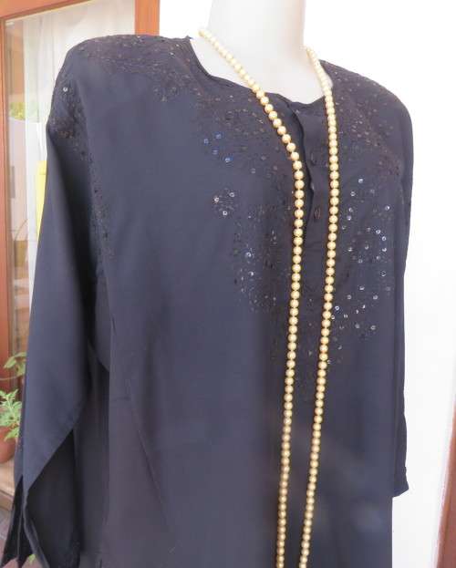 Very black long sleeve slip over 100% rayon richly embroidered/sequined top made in India.Size 46/22