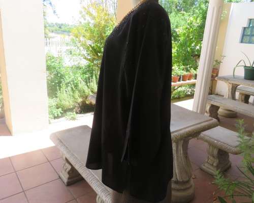 Very black long sleeve slip over 100% rayon richly embroidered/sequined top made in India.Size 46/22