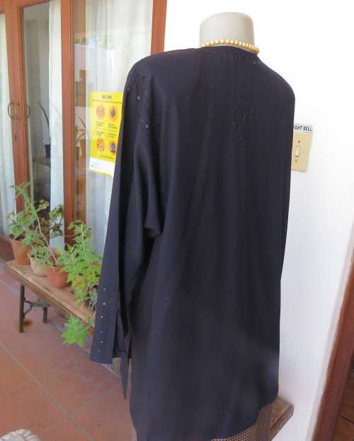 Very black long sleeve slip over 100% rayon richly embroidered/sequined top made in India.Size 46/22