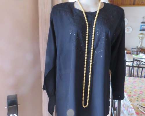 Very black long sleeve slip over 100% rayon richly embroidered/sequined top made in India.Size 46/22
