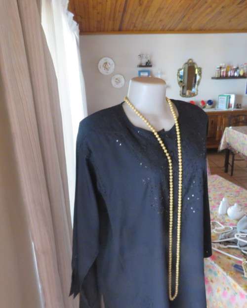 Very black long sleeve slip over 100% rayon richly embroidered/sequined top made in India.Size 46/22