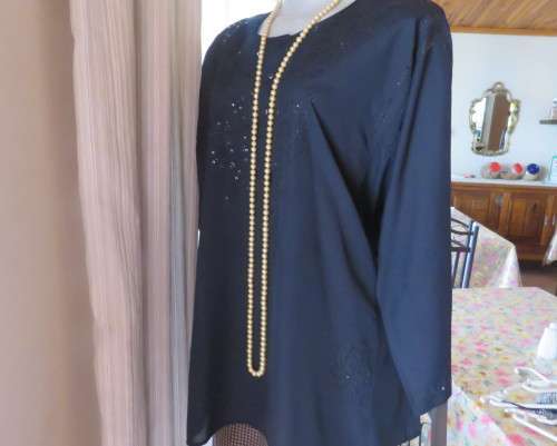 Very black long sleeve slip over 100% rayon richly embroidered/sequined top made in India.Size 46/22