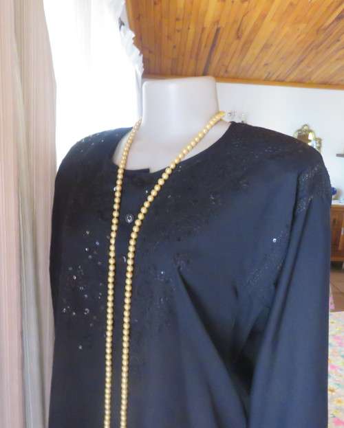 Very black long sleeve slip over 100% rayon richly embroidered/sequined top made in India.Size 46/22