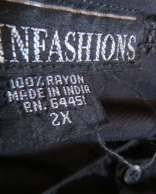Very black long sleeve slip over 100% rayon richly embroidered/sequined top made in India.Size 46/22