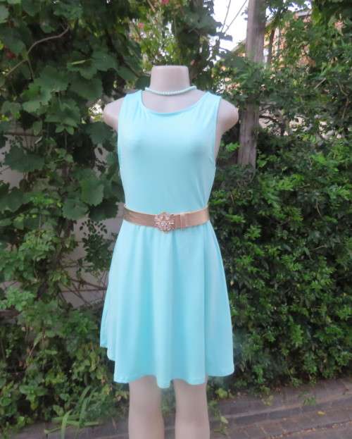 Ultra chic seafoam green size 36 short dress by H&M.Skater skirt.Fitted top.Xtra low V back.As new