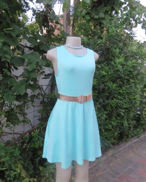 Ultra chic seafoam green size 36 short dress by H&M.Skater skirt.Fitted top.Xtra low V back.As new