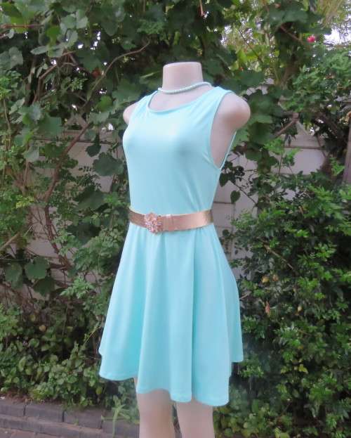 Ultra chic seafoam green size 36 short dress by H&M.Skater skirt.Fitted top.Xtra low V back.As new