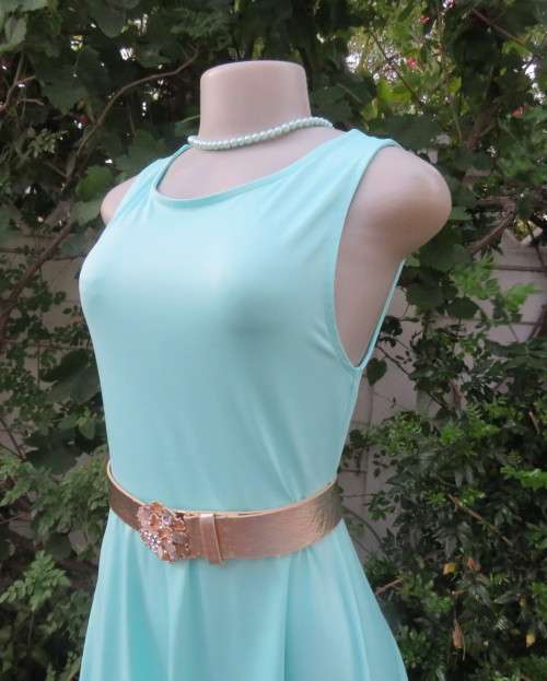 Ultra chic seafoam green size 36 short dress by H&M.Skater skirt.Fitted top.Xtra low V back.As new