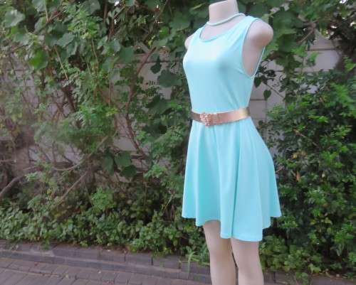 Ultra chic seafoam green size 36 short dress by H&M.Skater skirt.Fitted top.Xtra low V back.As new