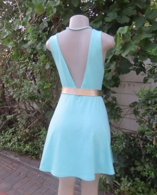 Ultra chic seafoam green size 36 short dress by H&M.Skater skirt.Fitted top.Xtra low V back.As new