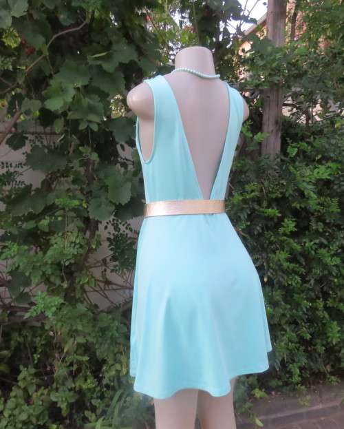 Ultra chic seafoam green size 36 short dress by H&M.Skater skirt.Fitted top.Xtra low V back.As new