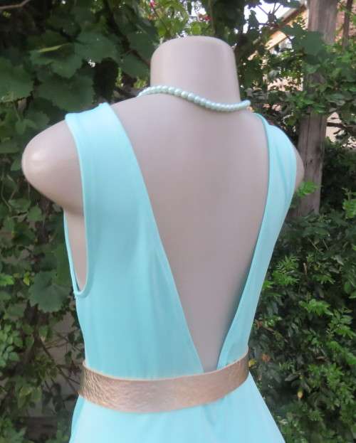 Ultra chic seafoam green size 36 short dress by H&M.Skater skirt.Fitted top.Xtra low V back.As new