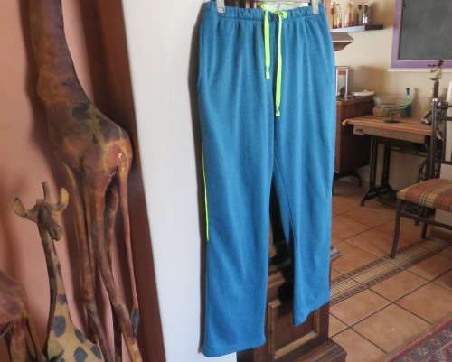 Men`s jade colour brushed polyester sport pants with yellow drawstring and leg edging.By MAXED in L.