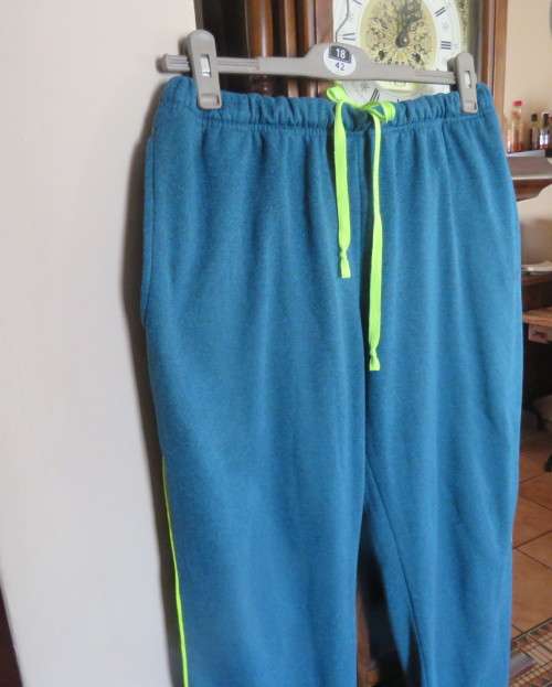 Men`s jade colour brushed polyester sport pants with yellow drawstring and leg edging.By MAXED in L.