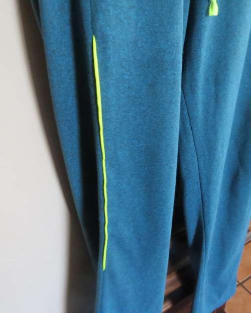 Men`s jade colour brushed polyester sport pants with yellow drawstring and leg edging.By MAXED in L.