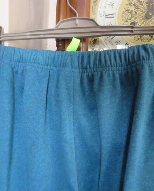 Men`s jade colour brushed polyester sport pants with yellow drawstring and leg edging.By MAXED in L.
