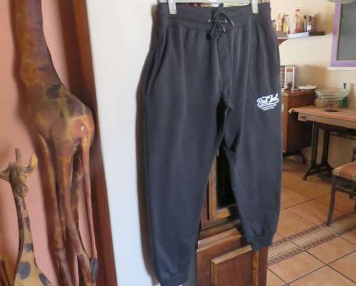 Men`s as new brushed polyester sweatpants. Knitted waist/drawstring and leg cuffs.Size XXL by RED