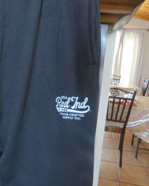 Men`s as new brushed polyester sweatpants. Knitted waist/drawstring and leg cuffs.Size XXL by RED