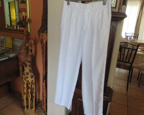 Handsome men`s white trousers by LION KNIGHT size 34 in cotton/terylene and silk.Pleated front.