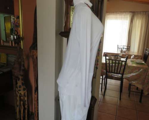 Handy white poloneck long sleeve top in stretch viscose by OR size 40/16.Perfect for under jacket.