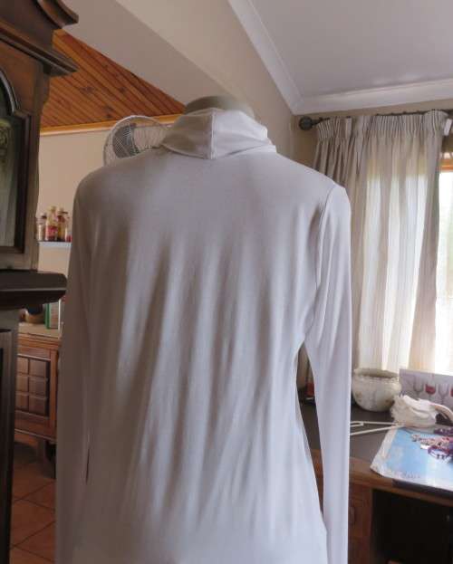 Handy white poloneck long sleeve top in stretch viscose by OR size 40/16.Perfect for under jacket.