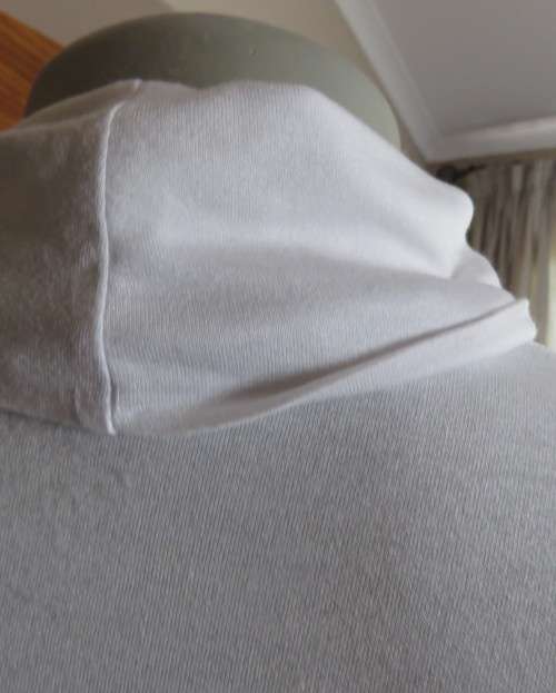 Handy white poloneck long sleeve top in stretch viscose by OR size 40/16.Perfect for under jacket.
