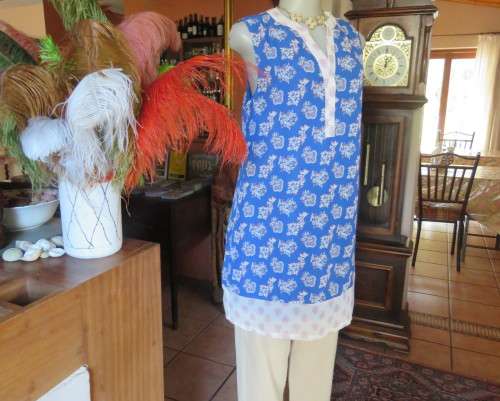 Cool blue white/pink floral knee length sheer polyester top.Stretch poly underlay.Size 36.As new