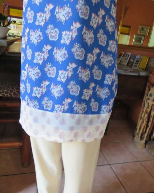 Cool blue white/pink floral knee length sheer polyester top.Stretch poly underlay.Size 36.As new