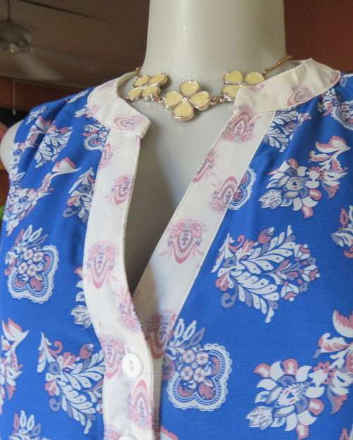 Cool blue white/pink floral knee length sheer polyester top.Stretch poly underlay.Size 36.As new