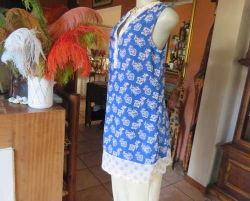 Cool blue white/pink floral knee length sheer polyester top.Stretch poly underlay.Size 36.As new