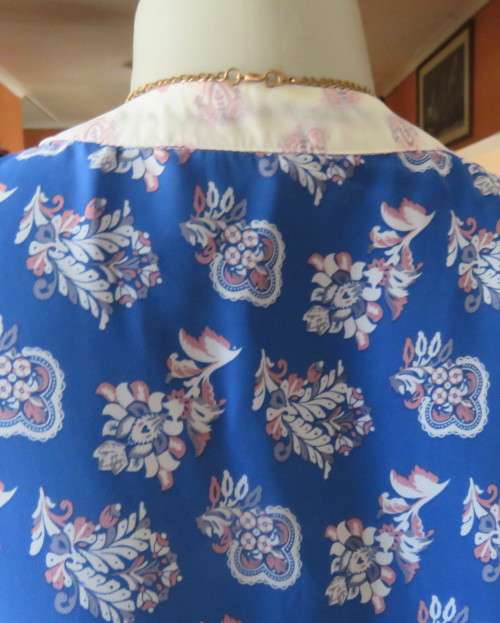 Cool blue white/pink floral knee length sheer polyester top.Stretch poly underlay.Size 36.As new