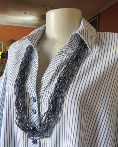Casual light blue/navy vertical striped button down V neck top with open collar.By PENNY C size 44