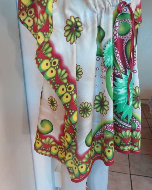Cool bo-ho top 100% rayon.Cream background with bold green/maroon/yellow.Drawstring waist.36/40