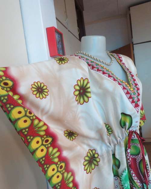 Cool bo-ho top 100% rayon.Cream background with bold green/maroon/yellow.Drawstring waist.36/40