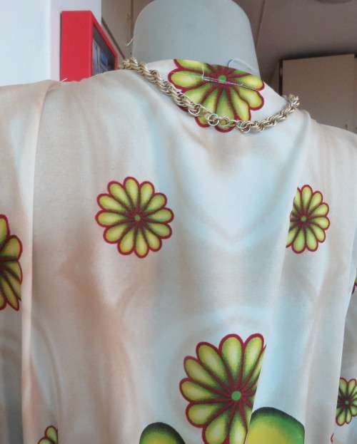 Cool bo-ho top 100% rayon.Cream background with bold green/maroon/yellow.Drawstring waist.36/40