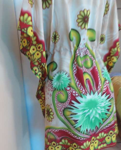 Cool bo-ho top 100% rayon.Cream background with bold green/maroon/yellow.Drawstring waist.36/40