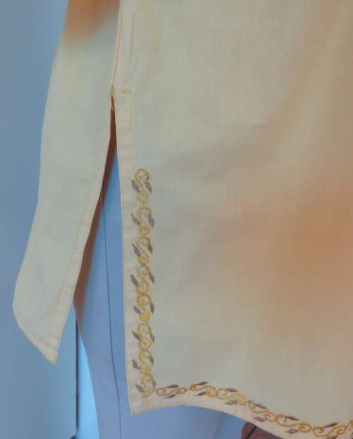 As new buttercup yellow richly embroidered top.Bracelet length sleeves.By BABA forn Kashmi.Size 40