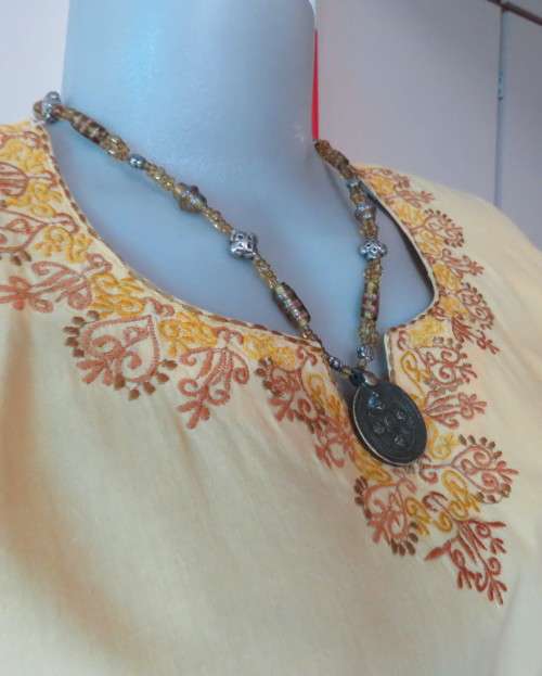 As new buttercup yellow richly embroidered top.Bracelet length sleeves.By BABA forn Kashmi.Size 40
