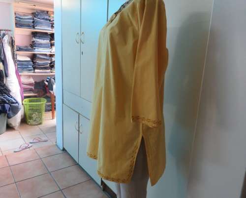 As new buttercup yellow richly embroidered top.Bracelet length sleeves.By BABA forn Kashmi.Size 40